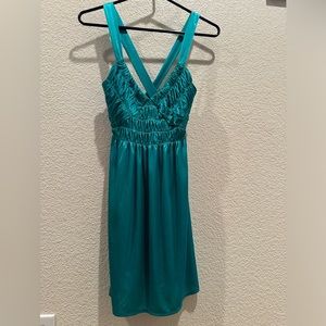Turquoise satin mini dress.